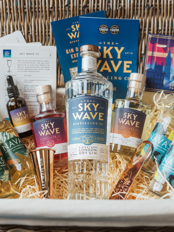A hamper full of gin and associated products.